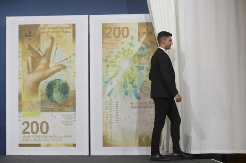 A curtain is drawn open on representations of Swiss francs